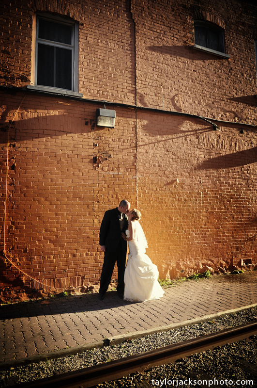 Orange wall in uptown waterloo bride and groom